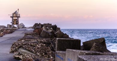 Newcastle breakwater walking path at sunset. The wall is 0.9m out from Nobby's head and topped with concrete cubes.