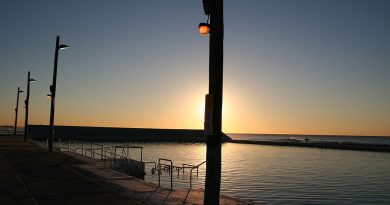 Photograph silhouette at sunrise of Newcastle Ocean Baths.