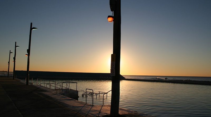 Photograph silhouette at sunrise of Newcastle Ocean Baths.